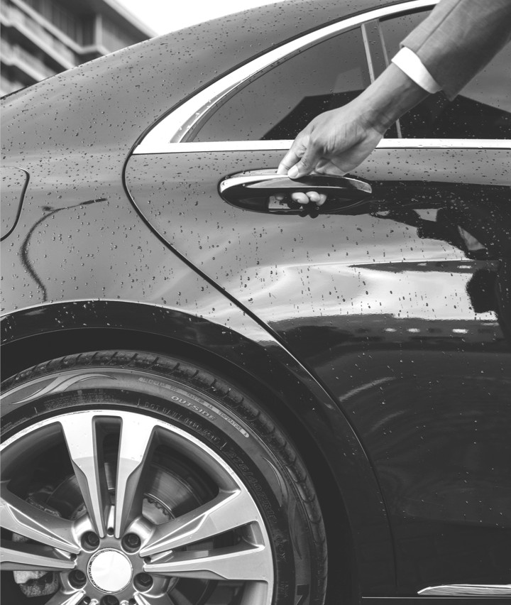 A hand opening a car door