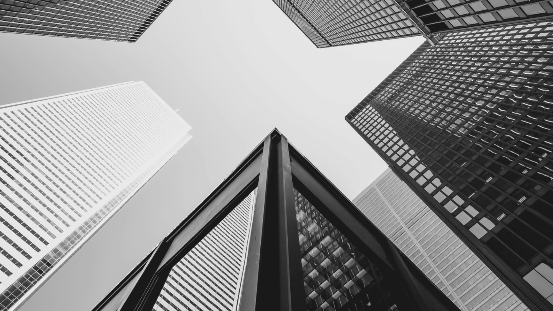 Looking up at several skyscrapers